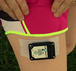 The Moxy Monitor on the thigh of a runner. It is tough enough for use on the rugby field.